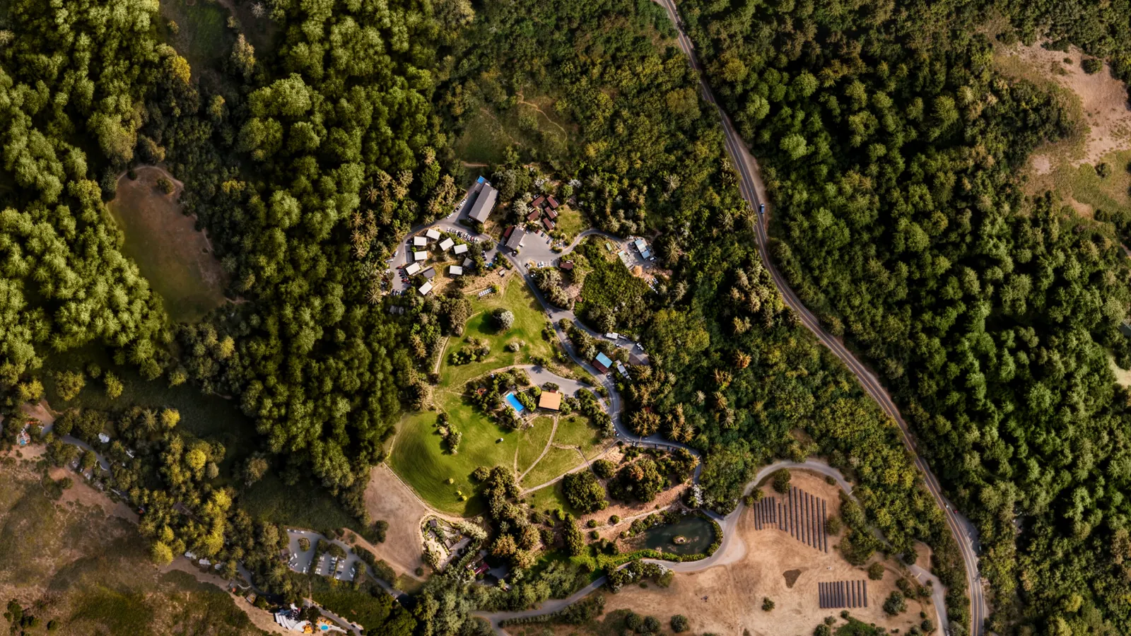 Advanced property orthophoto showing terrain, access, structures, and surrounding land context.