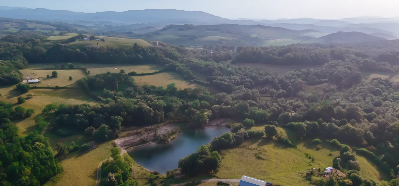 Drone-like property view showing terrain, setting, and spatial character.